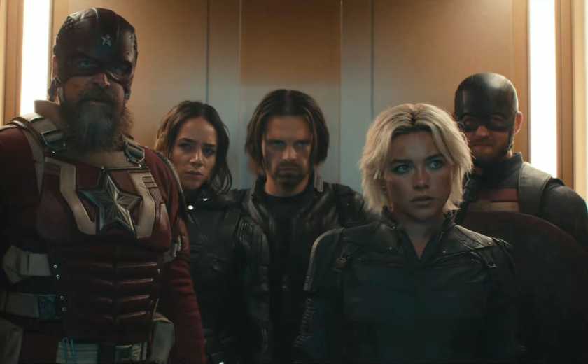 Yelena Belova/White Widow (Florence Pugh) reunites with father figure Alexei Shostakov/Red Guardian, then collides with U.S. Agent/John Walker (Wyatt Russell), Ghost/Ava Starr (Hannah John-Kamen), and the Winter Soldier/Bucky Barnes (Sebastian Stan) stand in an elevator in a still from Marvel’s Thunderbolts*
