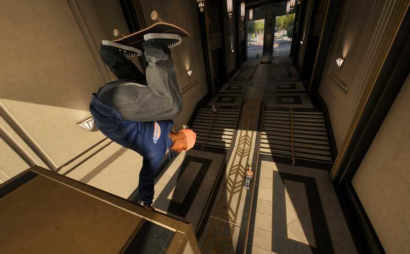 A skater performs a handstand on a ramp in Skate.